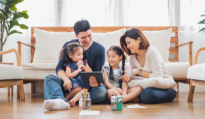 Happy family spending quality time underneath the quality roof
