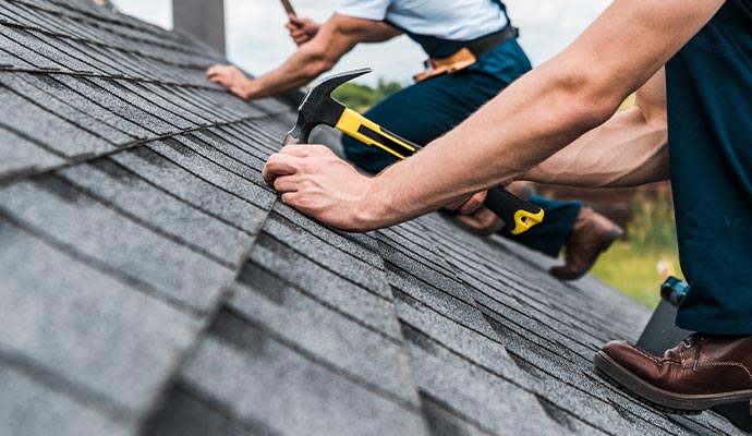 Person repairing roof